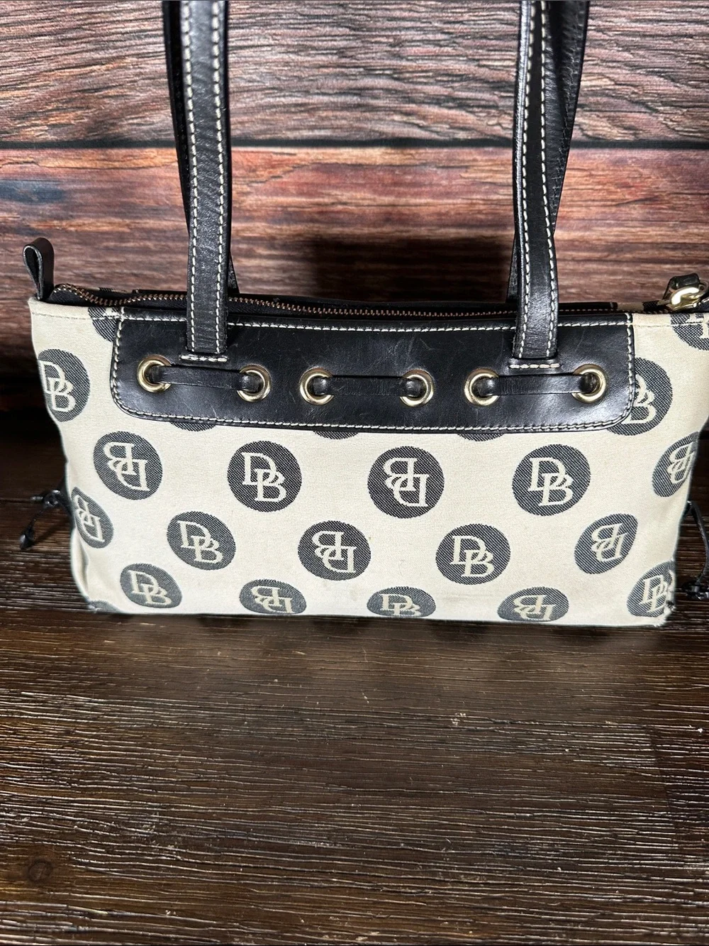 Dooney & Bourke Vintage logo jacquard handbag in cream and black.